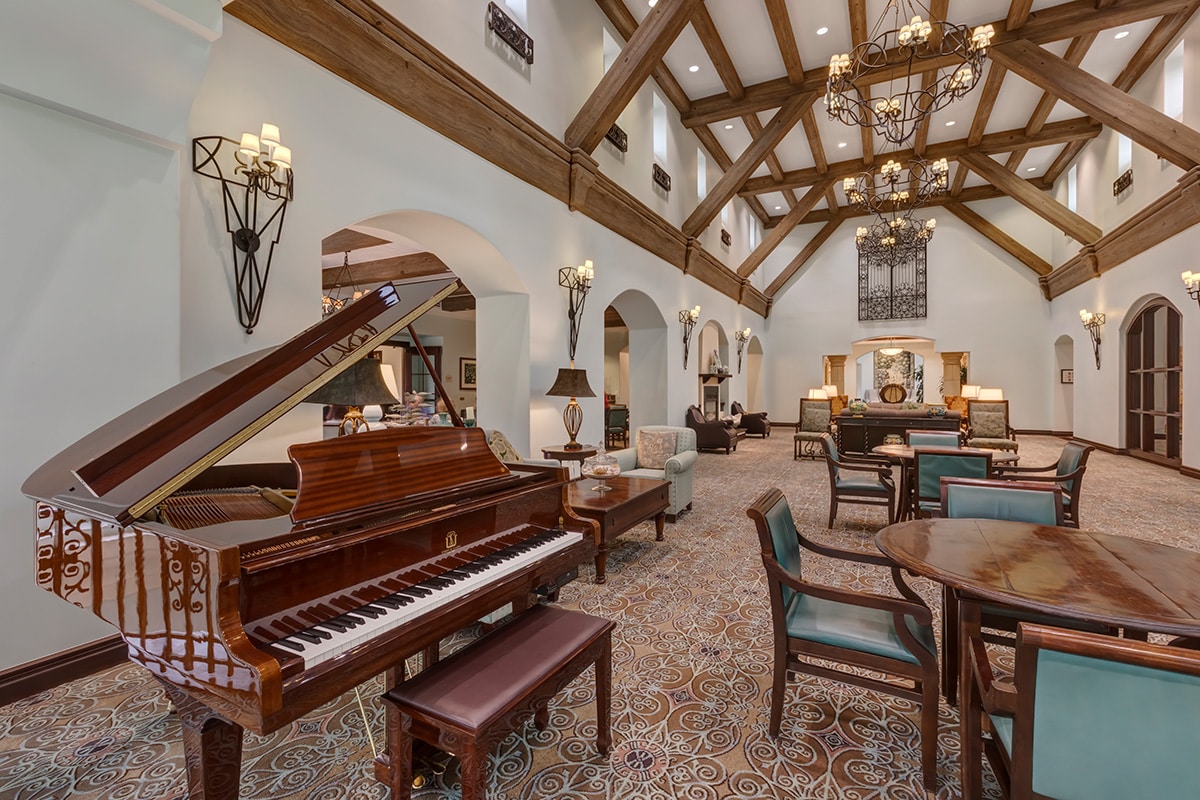 A grand piano in a common room at La Costa Glen